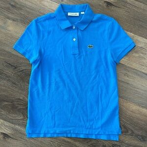 Lacoste women’s size 32 blue polo shirt 2 button closure with  collar